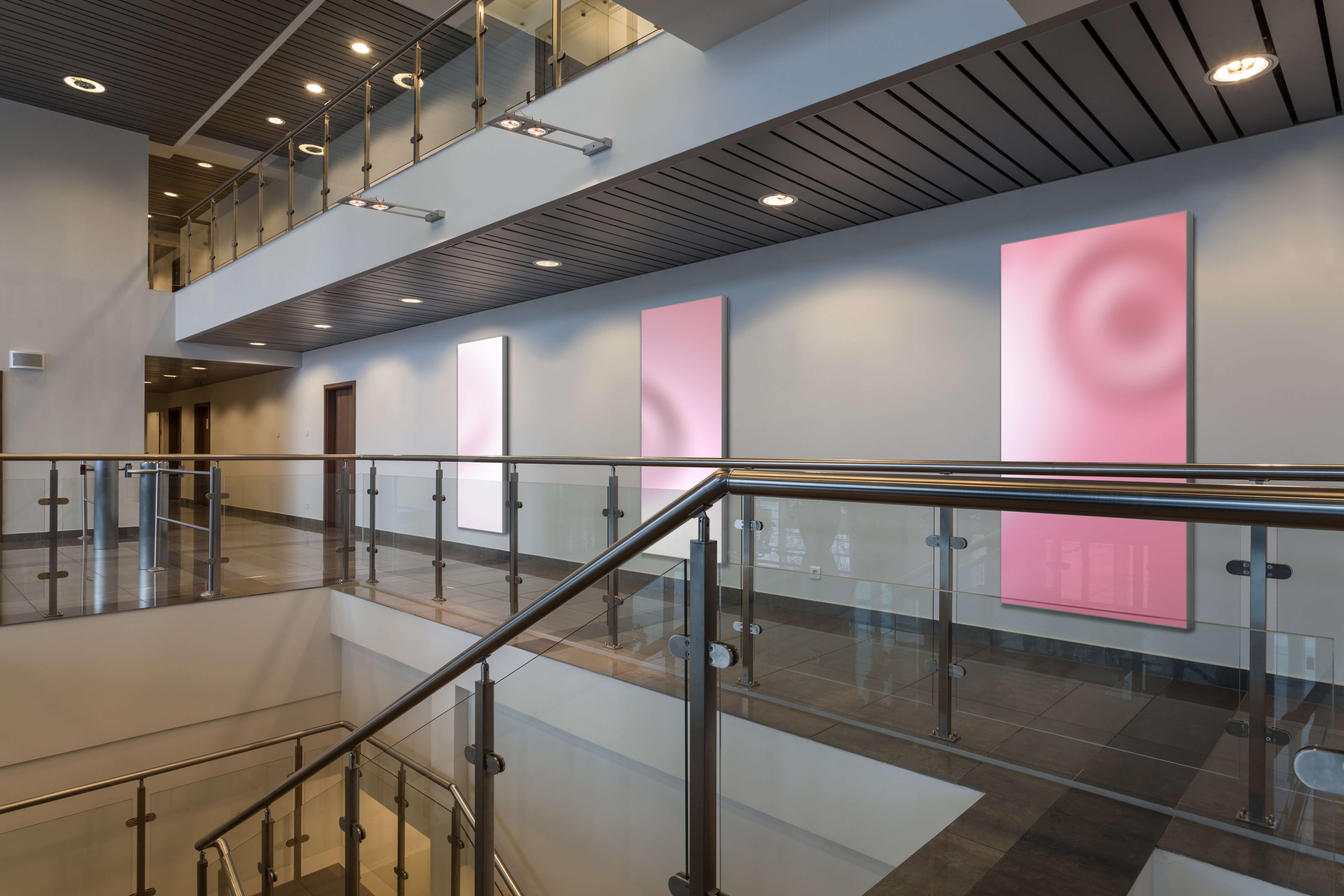 Pink colored dynamic light surface in a hallway 